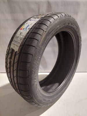 a close up of a tire on a white surface