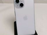 a close up of a white iphone sitting on top of a black stand