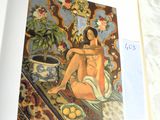 an open book with a picture of a woman sitting on a bed