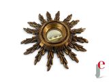 an image of a gold sunburst on a white background