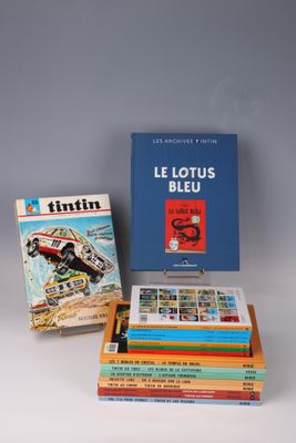 a collection of books on a white surface with a blue box
