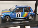 a toy car that is on display in a glass case