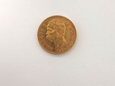 une image d'une pièce d'or sur une surface blanche