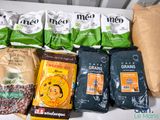 several bags of coffee are lined up on a table