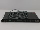 a close up of a black electronic device on a white surface