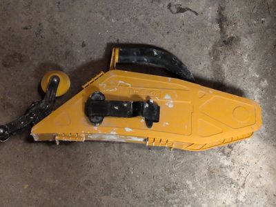 a yellow object that is laying on the ground