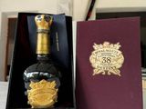 a bottle of liquor in a box on a table