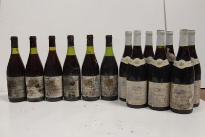 several bottles of wine are lined up in a row on a table