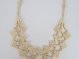 necklace made of wooden squares and beads on a white background