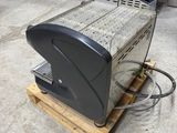 an image of a microwave sitting on a pallet in a kitchen
