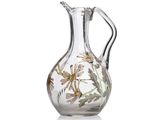 a glass vase with a floral design on it