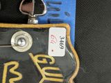 a close up of a guitar with a guitar picker attached to it