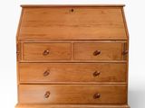 a wooden desk with drawers and drawers on top of it
