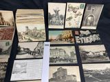 a lot of old postcards that are on a table
