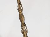 brass plated spoon with a handle and handles on a white background