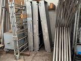 a pile of metal pipes sitting in a garage