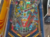 a pinball machine that is sitting on a table