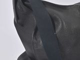black leather shoulder bag on white background with black strap