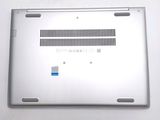 a silver laptop with a blue sticker on it