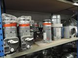 many pots and pans on a shelf in a store