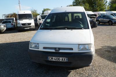 a white van that is parked in a parking lot