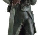 statue of a soldier holding a rifle and a flag on a white background