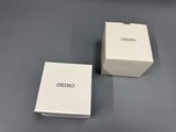 a couple of white boxes sitting on top of a table