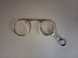 a pair of magnifying glasses sitting on a table