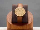a wooden stand with a watch on top of it