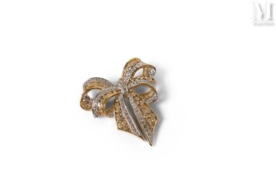 an image of a diamond bow brooch on a white background