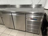 a stainless steel counter top in a commercial kitchen