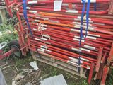 a pile of red pipes that are stacked on top of each other