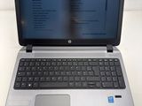 an open laptop computer sitting on top of a white table