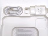 a white tray with a charger and a charger attached to it