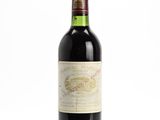 a bottle of wine that is sitting on a table