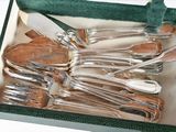 silverware in a green box with a green handle and green lining