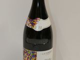 a bottle of wine that is sitting on a table