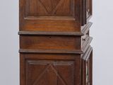 an old wooden cabinet with three drawers on wheels on a wooden floor