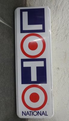 a sign that says lotto on the side of a building