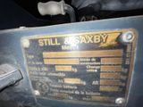 a close up of a metal plate on the side of a machine