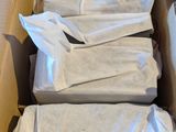 a cardboard box that has a bunch of bags in it