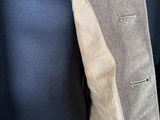 a close up of a man ' s jacket and tie on a mannequin mannequin mannequin mannequin mannequin manne