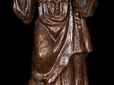 an image of a statue of a man with a hat and robe