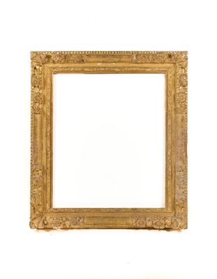 an old picture frame with a white background and a white wall