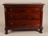 an antique chest of drawers with a marble top
