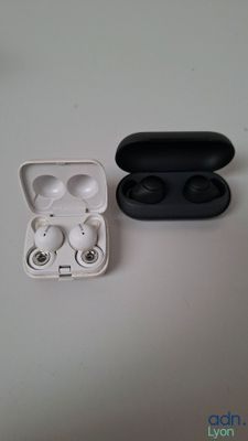 an image of a pair of earphones sitting on top of a table