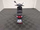 a motor scooter that is parked in a room