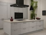 a large kitchen with a center island and a stove