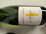 a bottle of wine that is sitting on a table