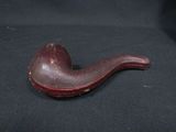 a pipe that is sitting on a black surface